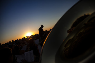 Philharmonic orchestra concert at sunset