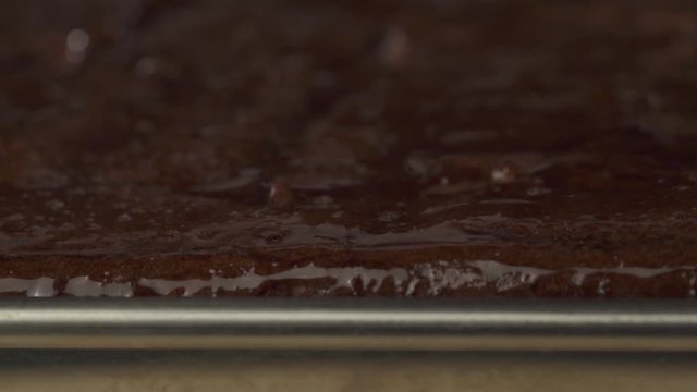 Macro closeup of freshly baked chocolate cake - video in slow motion