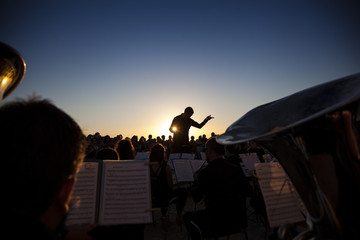 Philharmonic orchestra concert at sunset - obrazy, fototapety, plakaty