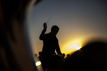 Philharmonic orchestra concert at sunset