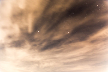Desert night sky stars cloudy view.