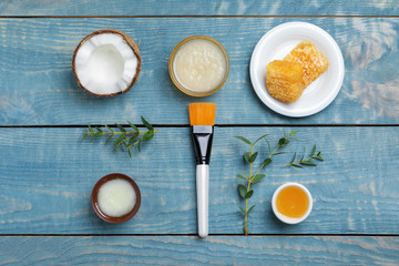 Homemade effective acne remedy and ingredients on wooden background