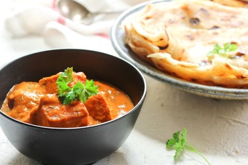 Homemade Paneer Butter Masala served with Paratha