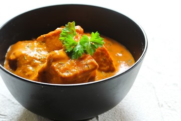 Homemade Paneer Tikka Masala on white background