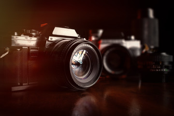 Fototapeta na wymiar Vintage professional film cameras and lenses