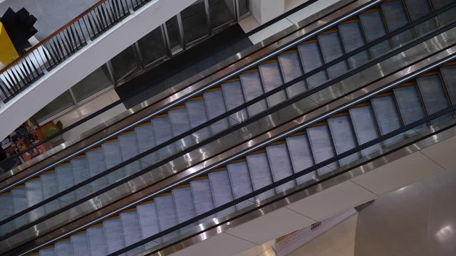 escalator moving up transport in floor of modern business building