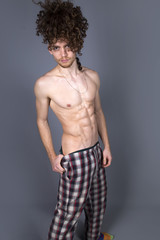 Fototapeta premium Young athletic ginger in pyjamas man studio portrait