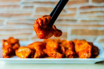 chicken wings marinated in a barbecue sauce, a typical American snack