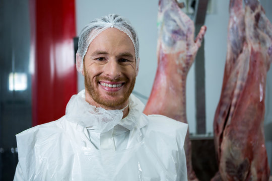 Portrait of butcher smiling at camera