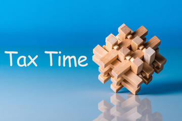 tax time, reminder with wooden brain teaser