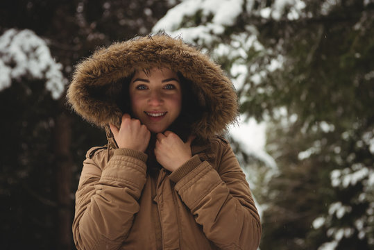 Smiling Woman In Fur Jacket During Winter