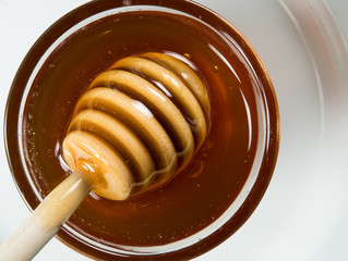 Honey Dipper Floats Atop Honey