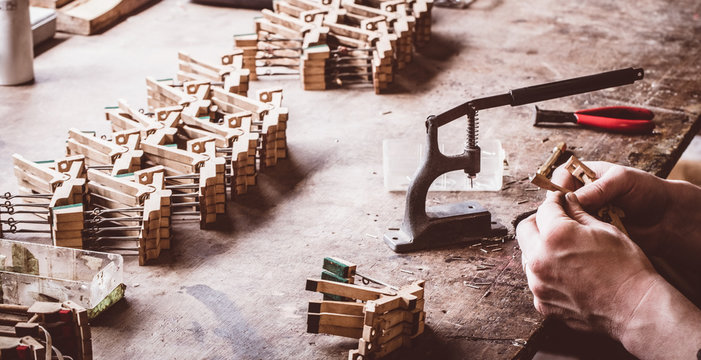 Piano technician working on piano parts