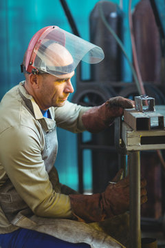 Mature man working in workshop