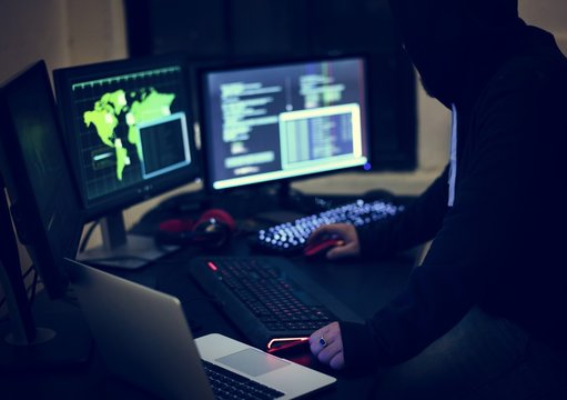 Hacker working using computer with codes