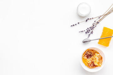 Fototapeta premium Aromatic theraphy and delicate skin care. Spa set based on honey on white background top view copy space