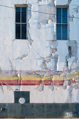 Peeling paint on the exterior of a building in downtown Anniston, Alabama, USA