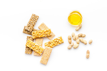 Energy protein snacks with peanuts on white background top view