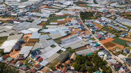 Aerial view e to Dalat city roofs and farms.Located on the Langbian Plateau in the southern parts of the Central Highlands region of Vietnam