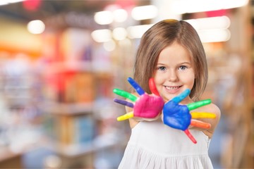 Little girl with hands in colored