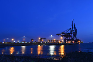 Fototapeta na wymiar Port crane bridge and bulk carrier