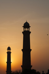 The minarets of the mosque during sunset