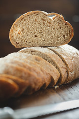 Close up chopped fresh bread wooden table