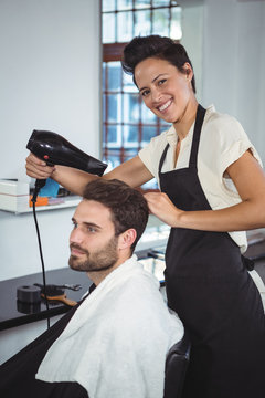 Man getting his hair dried with hair dryer