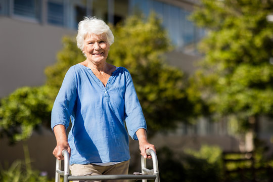 Senior woman posing with her Zimmer Frame