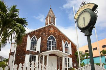 Fototapeta na wymiar The Methodist Church with a traditional street clock outside, Philipsburg, St Maarten, Caribbean.