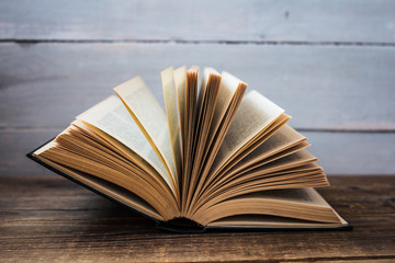 open book on wooden background