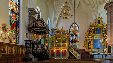 Fototapeta na wymiar Stained glass windows, the altar, the pulpit and the 