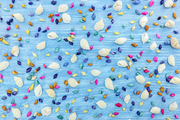 Fototapeta na wymiar marine theme background. painted blue table surface with multicolor sea shells