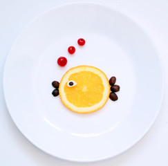 stock-photo-little-orange-fish-from-food-on-the-white-plate-creative-idea-food-art-funny-fish