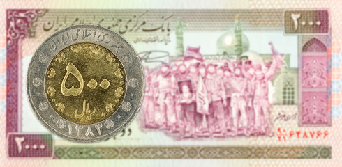 500 iranian rial coin against 2000 iranian rial note obverse