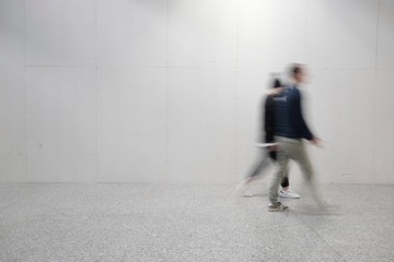 blurred people at the airport - Powered by Adobe