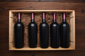 Wood case of red wine bottles © Steve Cukrov