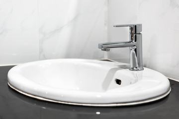 Bathroom interior with sink and faucet