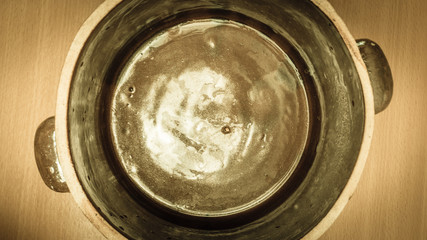Brown clay jar view from above