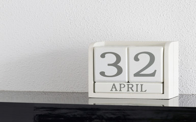 White block calendar present date 32 and month April - Extra day