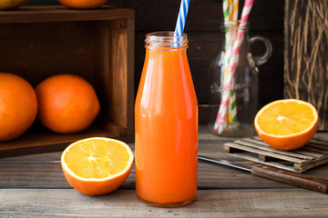 Refreshing summer drink: orange juice rustic background