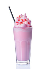 Crazy pink milk shake with whipped cream, sprinkles and black straw in glass