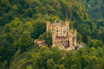 Fototapeta na wymiar Castle Hohenschwangau in Germany. The Royal Palace in Bavaria. The yellow famous palace is a tourist attraction. 