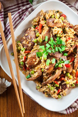 Fried rice with chicken and vegetables served on a plate
