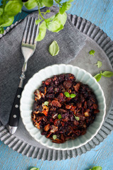 Black rice with raisins and fried onion, top view, selective focus