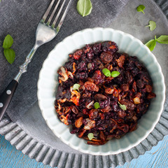 Black rice with raisins and fried onion, top view, selective focus