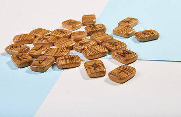 Wooden runes from the texture tree on a white-blue background