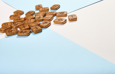 Wooden runes from the texture tree on a white-blue background