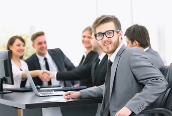 Fototapeta premium handshake business partners with the Manager in the foreground