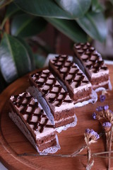 Biscuit cakes with cream on a wooden Board